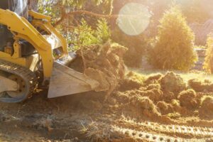 The bulldozer moves soil digging ground construction equipment